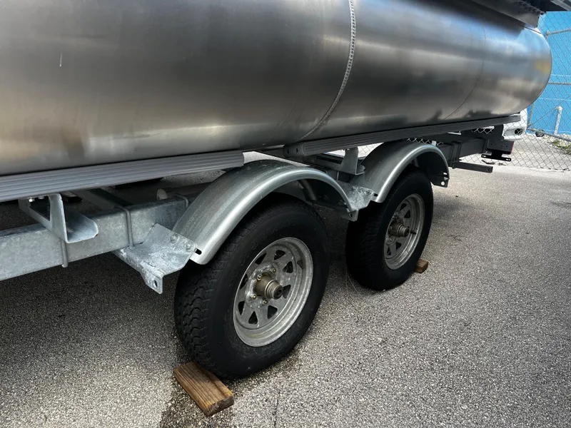 Slide: The Image of 2024 Bentley Pontoons Fish 20 trailer with dual axle wheels. - 12