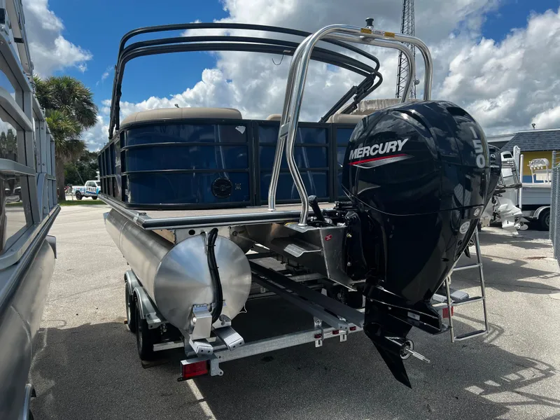 Slide: The Image of 2024 Bentley Pontoons Fish 20 with Mercury outboard motor, rear view. - 4