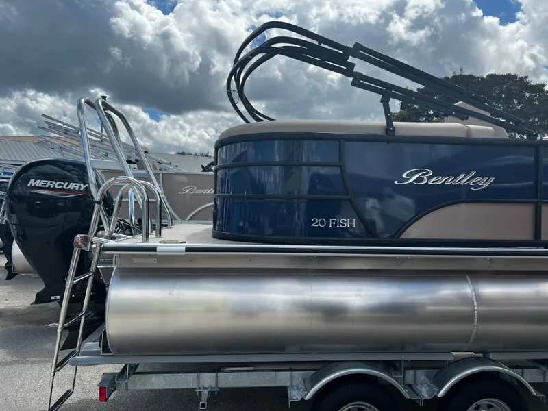 Slide: The Image of 2024 Bentley Pontoons Fish 20 on trailer with Mercury outboard motor. - 5