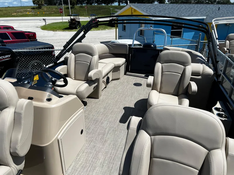 Slide: The Image of 2024 Bentley Pontoons Fish 20 interior with plush seating and modern helm. - 6