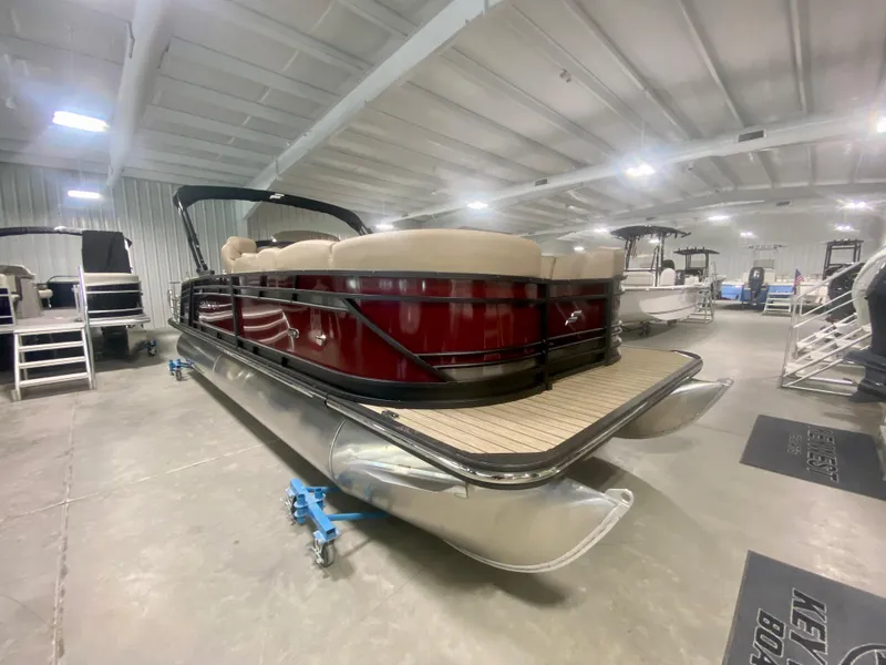Slide: The Image of 2024 Starcraft SLS 3 Q DH pontoon boat in showroom. - 1