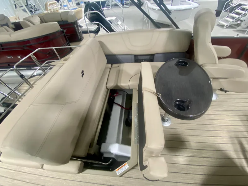 Slide: The Image of 2024 Starcraft SLS 3 Q DH boat interior with beige seating and round table. - 14
