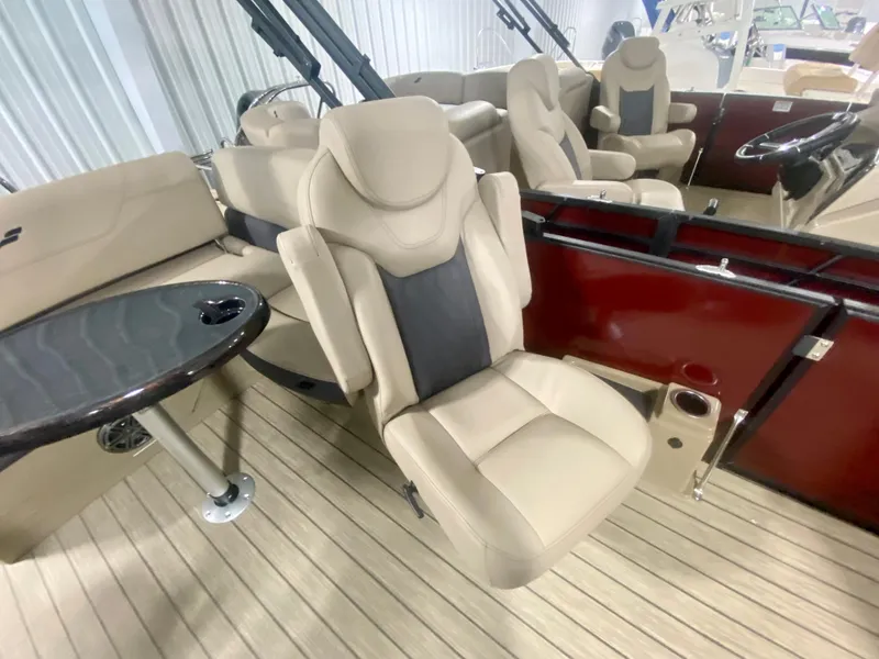 Slide: The Image of 2024 Starcraft SLS 3 Q DH boat interior with beige seating and table. - 21