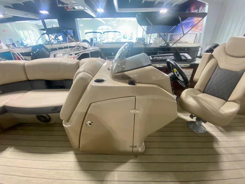 Slide: The Image of 2024 Starcraft SLS 3 Q DH pontoon boat interior with helm and seating. - 24