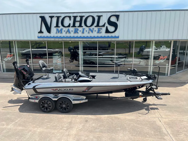Slide: The Image of 2024 Vexus VX 20 boat displayed at Nichols Marine dealership. - 1