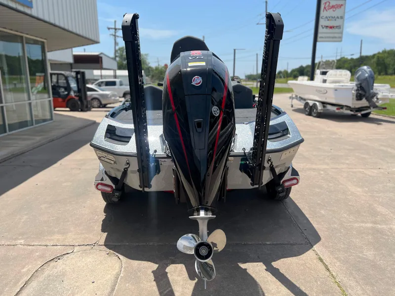 Slide: The Image of 2024 Vexus VX 20 boat rear view with outboard motor and power poles. - 3