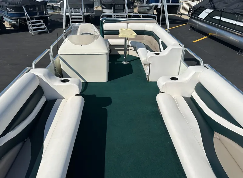 Slide: The Image of 1998 Suncruiser 240 Trinidad pontoon boat with spacious seating and green carpet. - 11