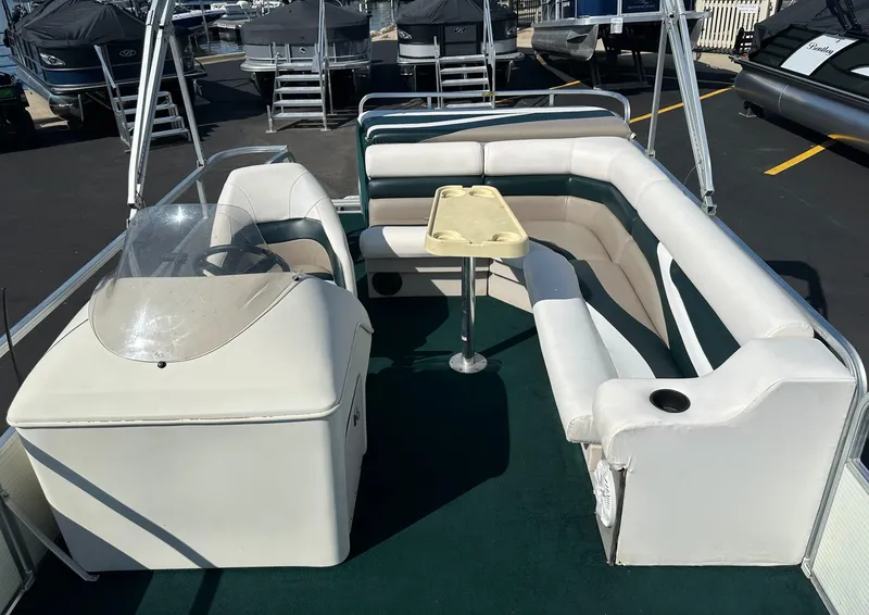 Slide: The Image of 1998 Suncruiser 240 Trinidad pontoon boat interior with seating and table. - 15