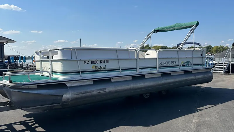 Slide: The Image of 1998 Suncruiser 240 Trinidad pontoon boat with green canopy on a sunny day. - 4