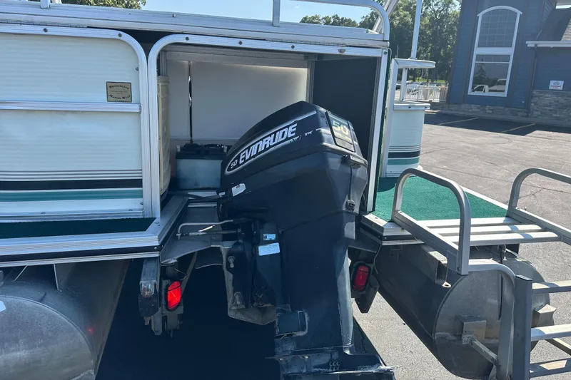 Slide: The Image of 1998 Suncruiser 240 Trinidad pontoon boat with Evinrude outboard motor. - 8