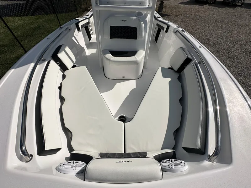 Slide: The Image of 2024 Tidewater 210 CC Adventure boat interior with cushioned seating and storage compartments. - 10