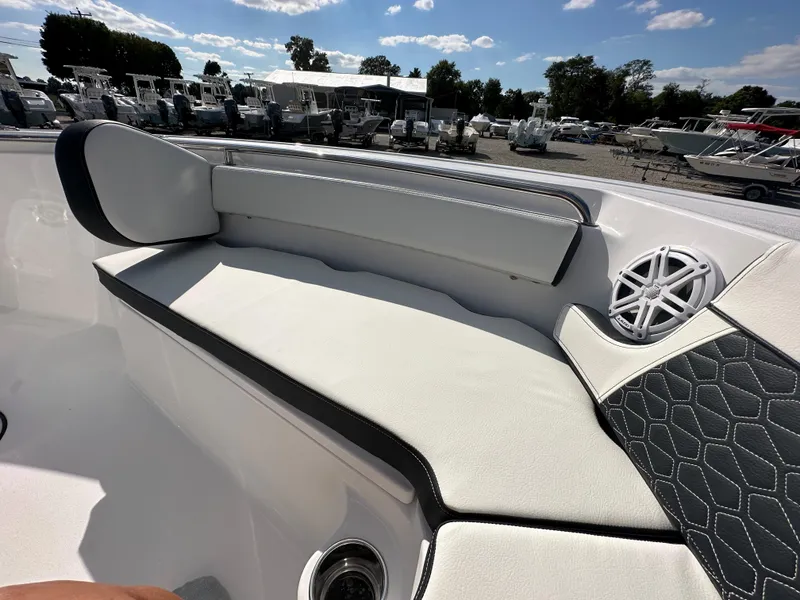 Slide: The Image of 2024 Tidewater 210 CC Adventure boat interior seating with speaker. - 11