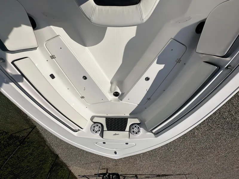 Slide: The Image of 2024 Tidewater 210 CC Adventure boat bow with seating and storage compartments. - 14