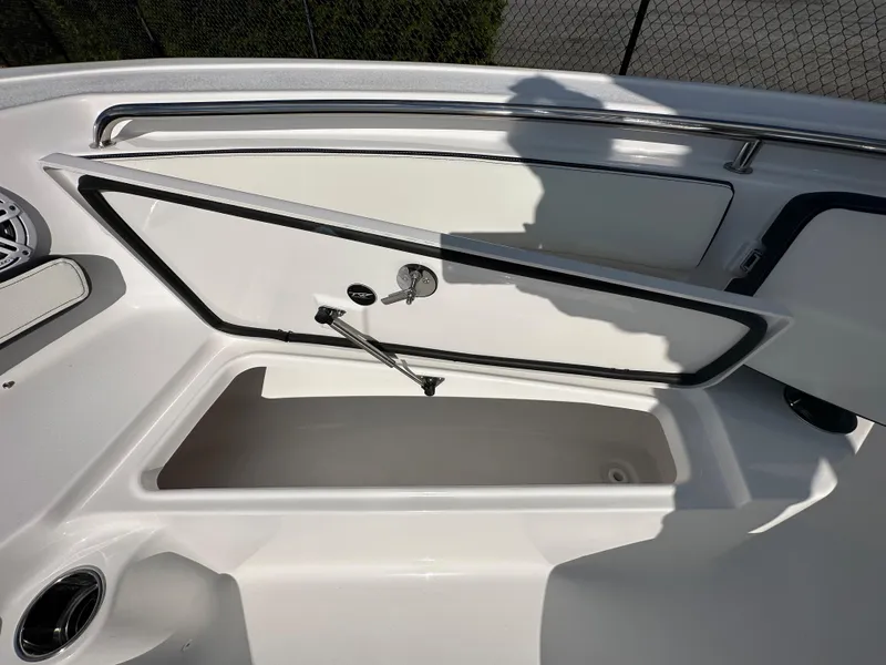 Slide: The Image of 2024 Tidewater 210 CC Adventure boat storage compartment with open hatch. - 17