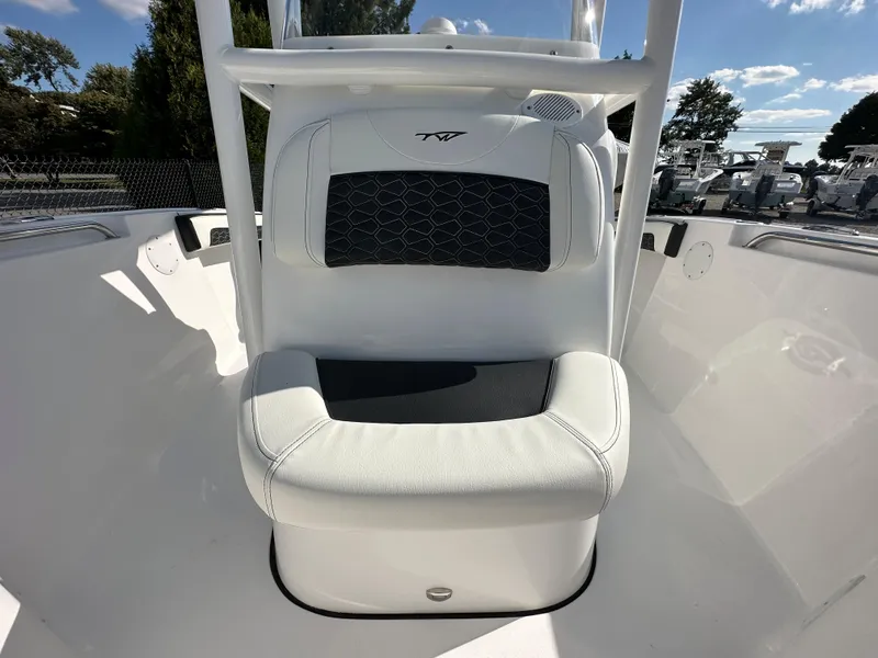 Slide: The Image of 2024 Tidewater 210 CC Adventure boat seat with white and black upholstery. - 18