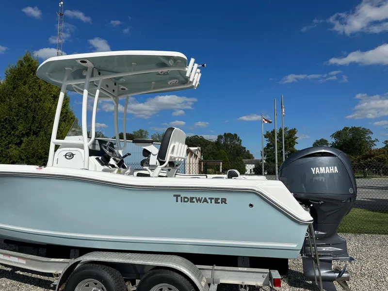 Slide: The Image of 2024 Tidewater 210 CC Adventure boat on a trailer with Yamaha outboard motor. - 2