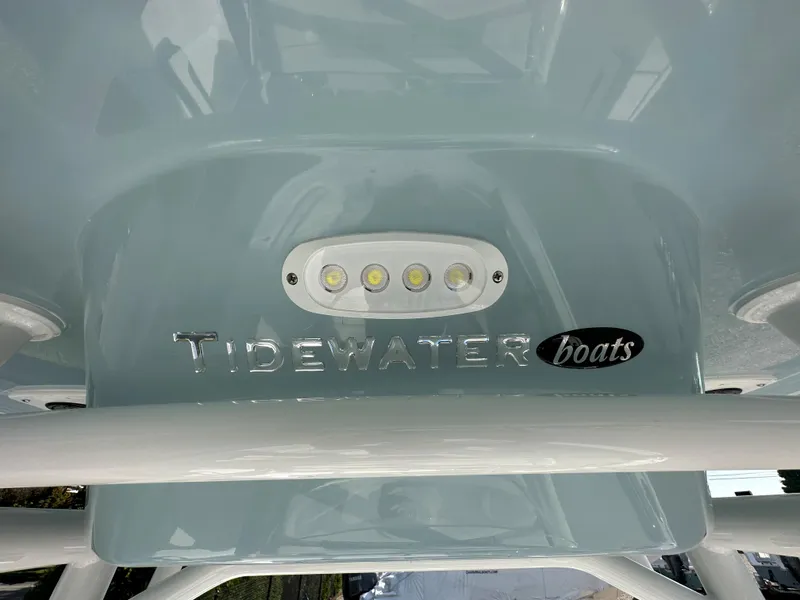 Slide: The Image of Tidewater 210 CC Adventure 2024 boat with LED lights and logo. - 22