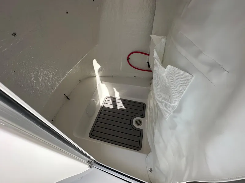 Slide: The Image of Interior of 2024 Tidewater 210 CC Adventure boat with storage compartment. - 28