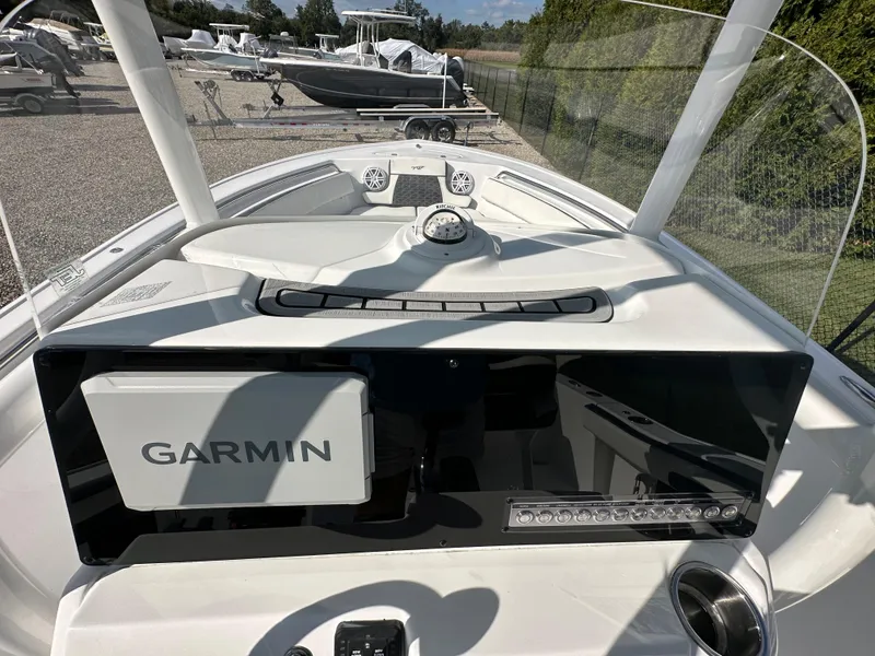 Slide: The Image of 2024 Tidewater 210 CC Adventure boat dashboard with Garmin navigation system. - 31