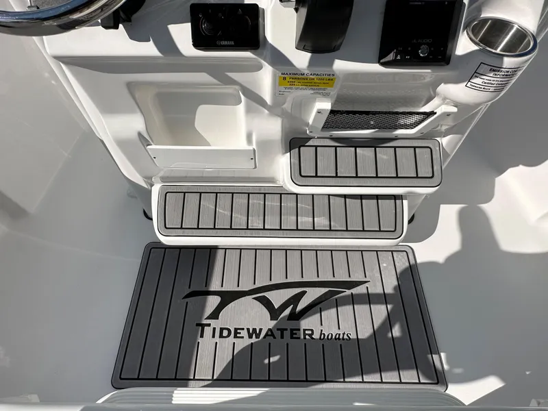 Slide: The Image of 2024 Tidewater 210 CC Adventure boat interior with branded floor mat. - 34