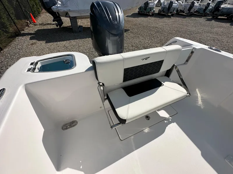 Slide: The Image of 2024 Tidewater 210 CC Adventure boat with rear seating and outboard motor. - 44