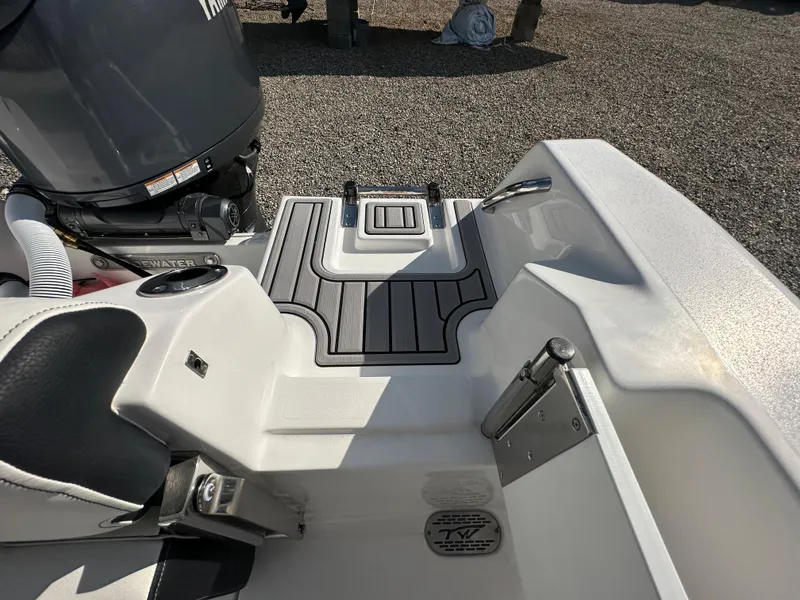 Slide: The Image of 2024 Tidewater 210 CC Adventure boat stern with motor and seating. - 46