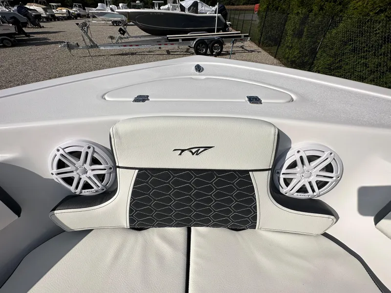 Slide: The Image of 2024 Tidewater 210 CC Adventure boat bow seating with speakers. - 7