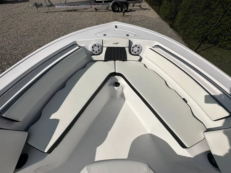 Slide: The Image of 2024 Tidewater 210 CC Adventure boat with spacious bow seating and built-in speakers. - 8