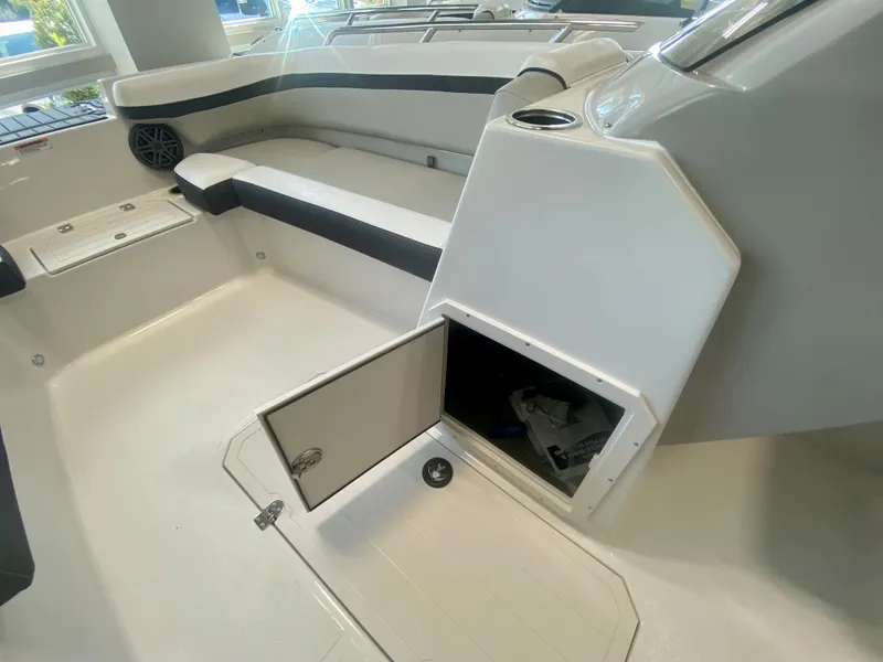 Slide: The Image of 2024 Starcraft SVX 191 boat interior with open storage compartment and seating area. - 14