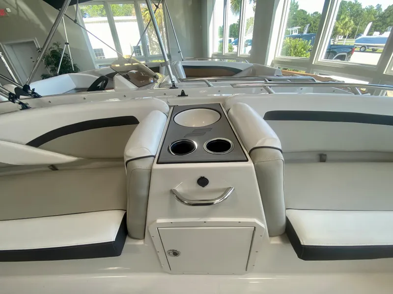 Slide: The Image of 2024 Starcraft SVX 191 boat interior with seating and cup holders. - 16