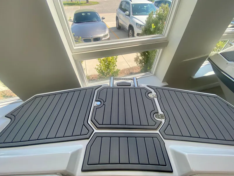 Slide: The Image of 2024 Starcraft SVX 191 boat deck with black and gray non-slip surface. - 25