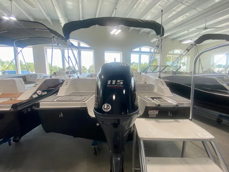 Slide: The Image of 2024 Starcraft SVX 191 boat with 115 horsepower engine in showroom. - 3