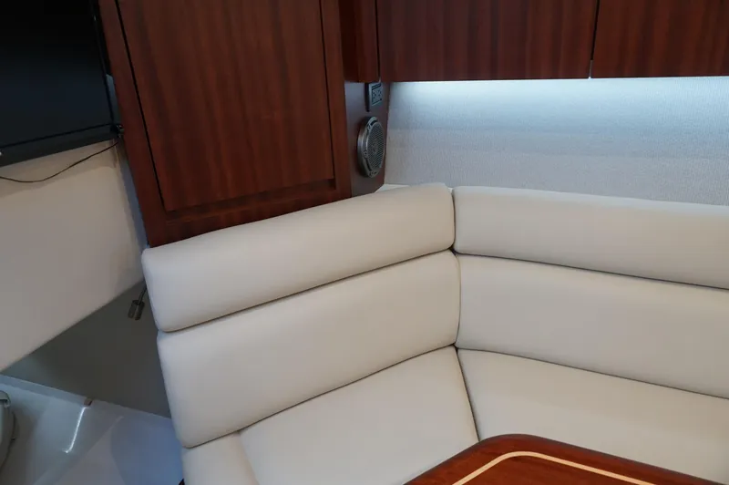 Slide: The Image of Interior of 2021 Jupiter 41 SB with beige sofa and wooden cabinetry. - 27