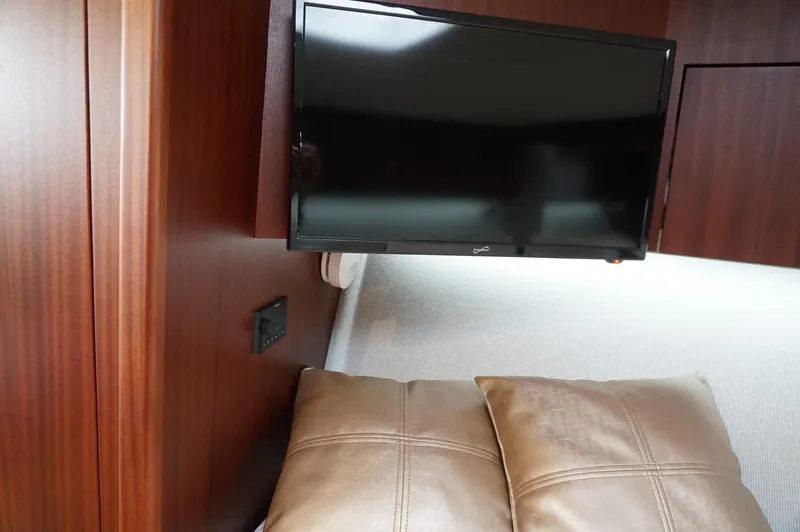 Slide: The Image of Interior of 2021 Jupiter 41 SB with TV and cushions. - 37