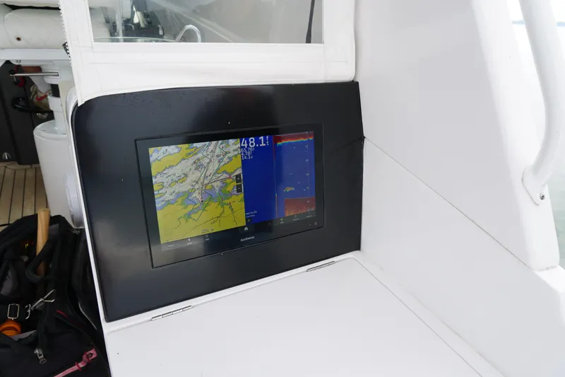 Slide: The Image of Garmin navigation display on 2021 Jupiter 41 SB boat, showing map and sonar data. - 40