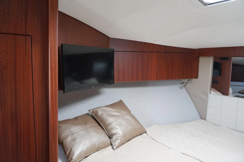 Slide: The Image of Luxurious interior of 2021 Jupiter 41 SB yacht with TV and elegant bedding. - 45