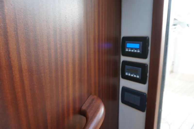 Slide: The Image of Control panel on a 2021 Jupiter 41 SB yacht with wooden interior. - 50
