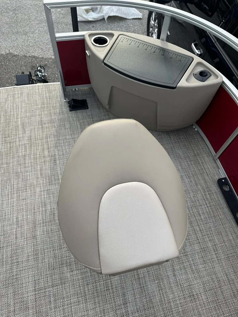 Slide: The Image of 2024 Ranger Reata 200F boat interior with beige seat and control panel. - 5