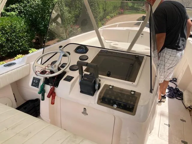 Slide: The Image of Interior view of a 2002 Intrepid 322 boat cockpit. - 12
