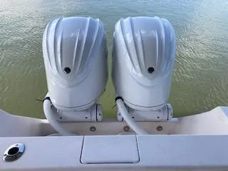 Slide: The Image of Two outboard motors on a 2002 Intrepid 322 boat. - 16