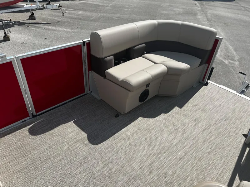 Slide: The Image of 2024 Bentley Pontoons LE 18 interior seating area with beige upholstery. - 11
