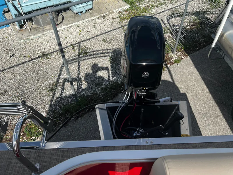 Slide: The Image of 2024 Bentley Pontoons LE 18 outboard motor and rear deck view. - 15