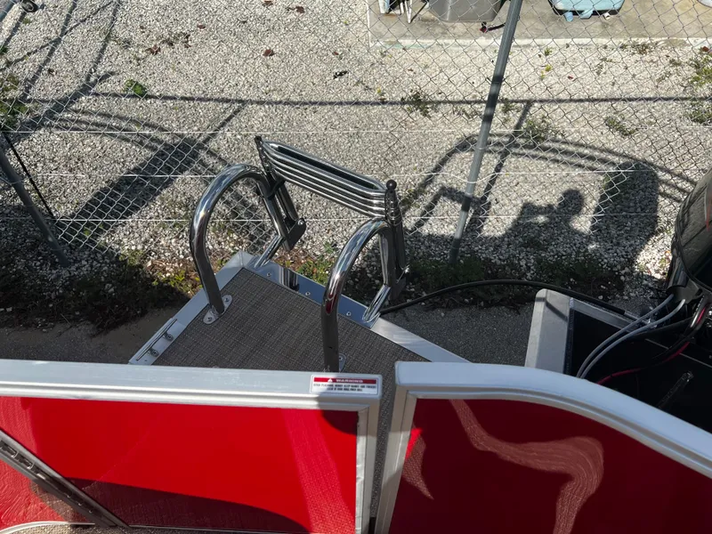Slide: The Image of 2024 Bentley Pontoons LE 18 boat ladder and rear deck area. - 16