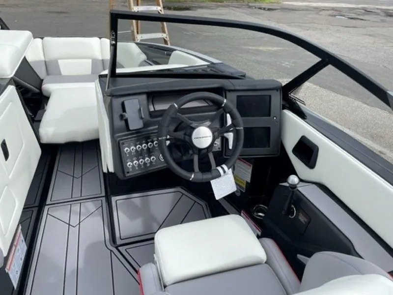 Slide: The Image of 2024 Moomba Craz boat interior with modern dashboard and seating. - 12