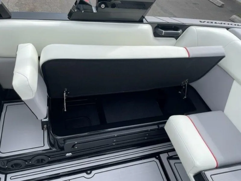 Slide: The Image of 2024 Moomba Craz boat interior with open storage compartment under seat. - 15