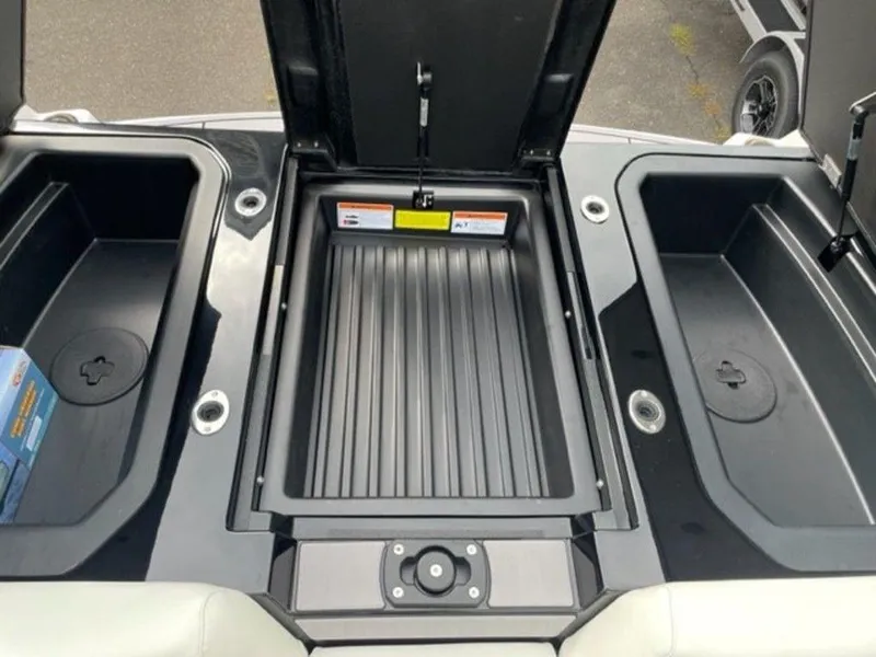 Slide: The Image of 2024 Moomba Craz boat storage compartments and engine bay. - 18