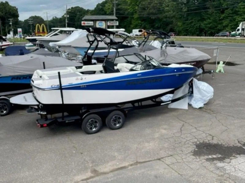 Slide: The Image of 2024 Moomba Craz boat on trailer in dealership lot. - 3