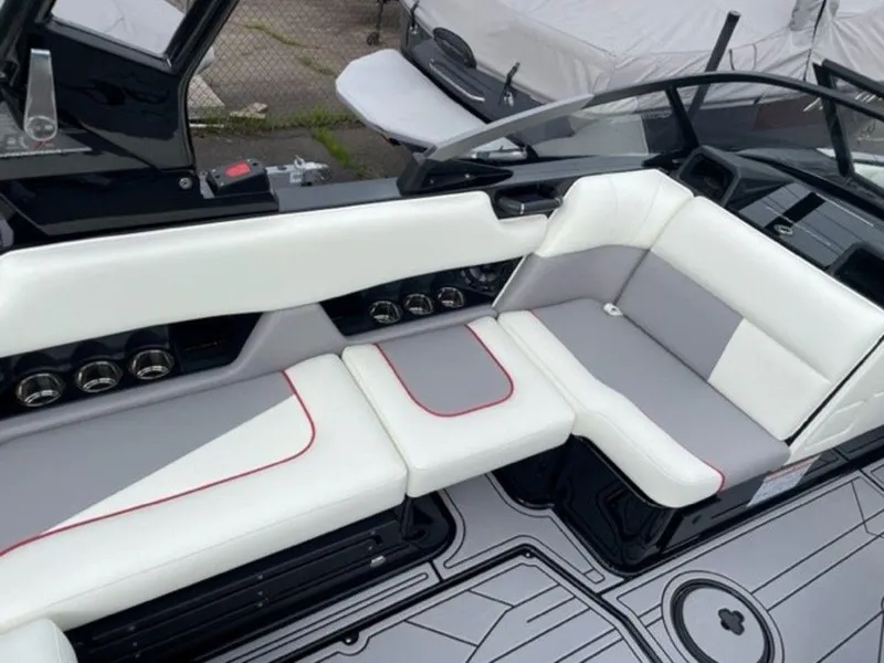 Slide: The Image of 2024 Moomba Craz boat interior with white and gray seating. - 9