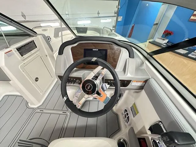Slide: The Image of 2024 Chaparral 21 SSi boat cockpit with steering wheel and dashboard. - 6