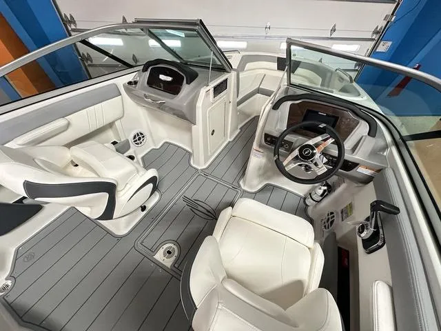 Slide: The Image of 2024 Chaparral 21 SSi boat interior with modern dashboard and seating. - 7